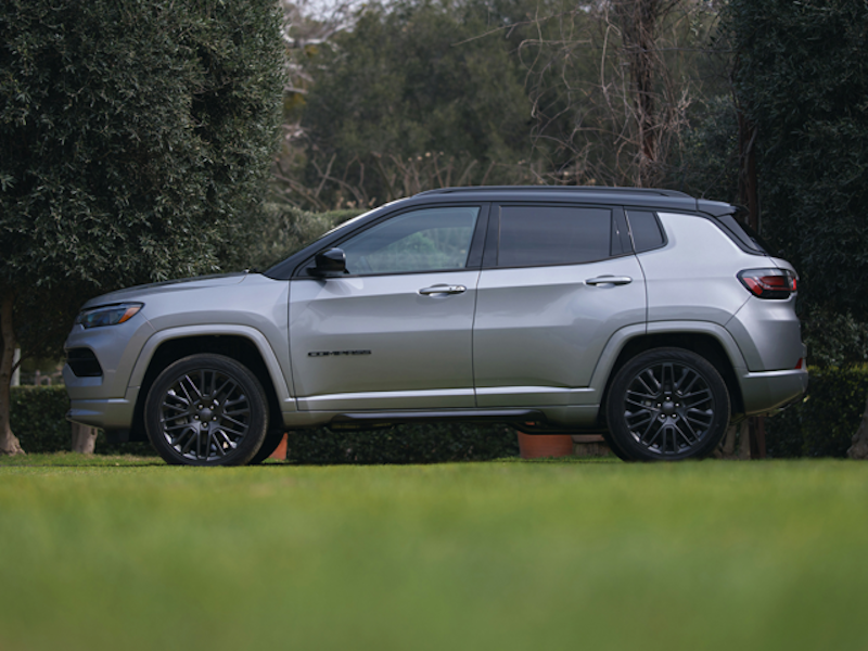 The 2024 Jeep Compass in a grass meadow