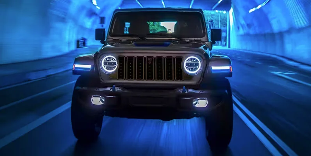 A 2024 Jeep Wrangler in an electrifying blue tunnel