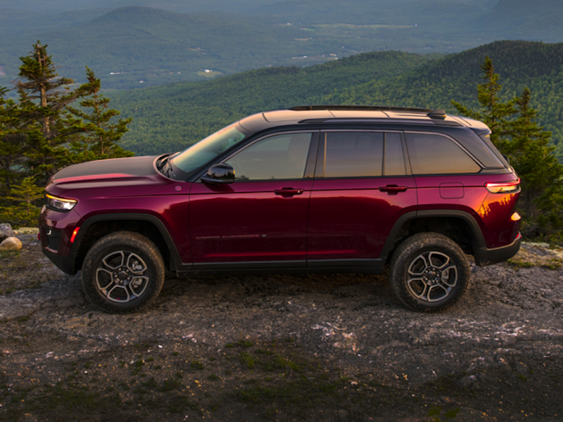 A 2024 Grand Cherokee from Jeep on top of a mountain.