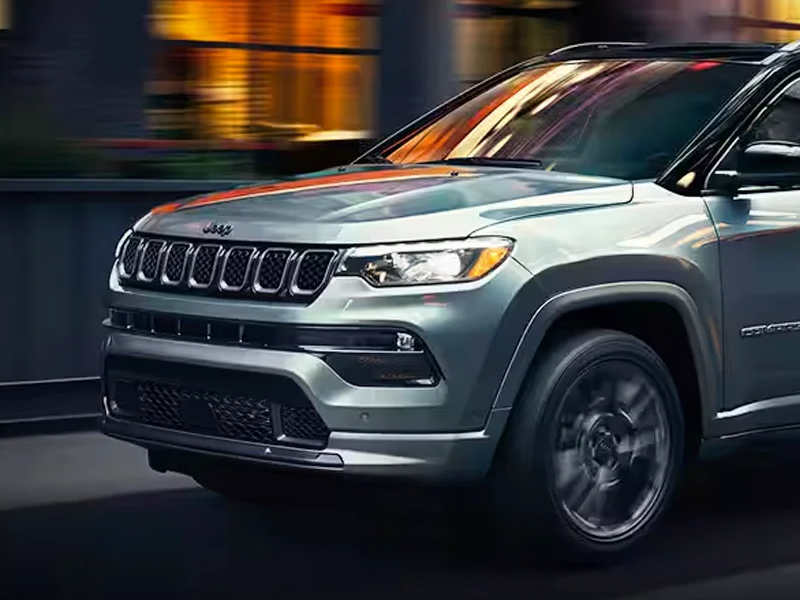 A 2024 Jeep Compass driving through the city