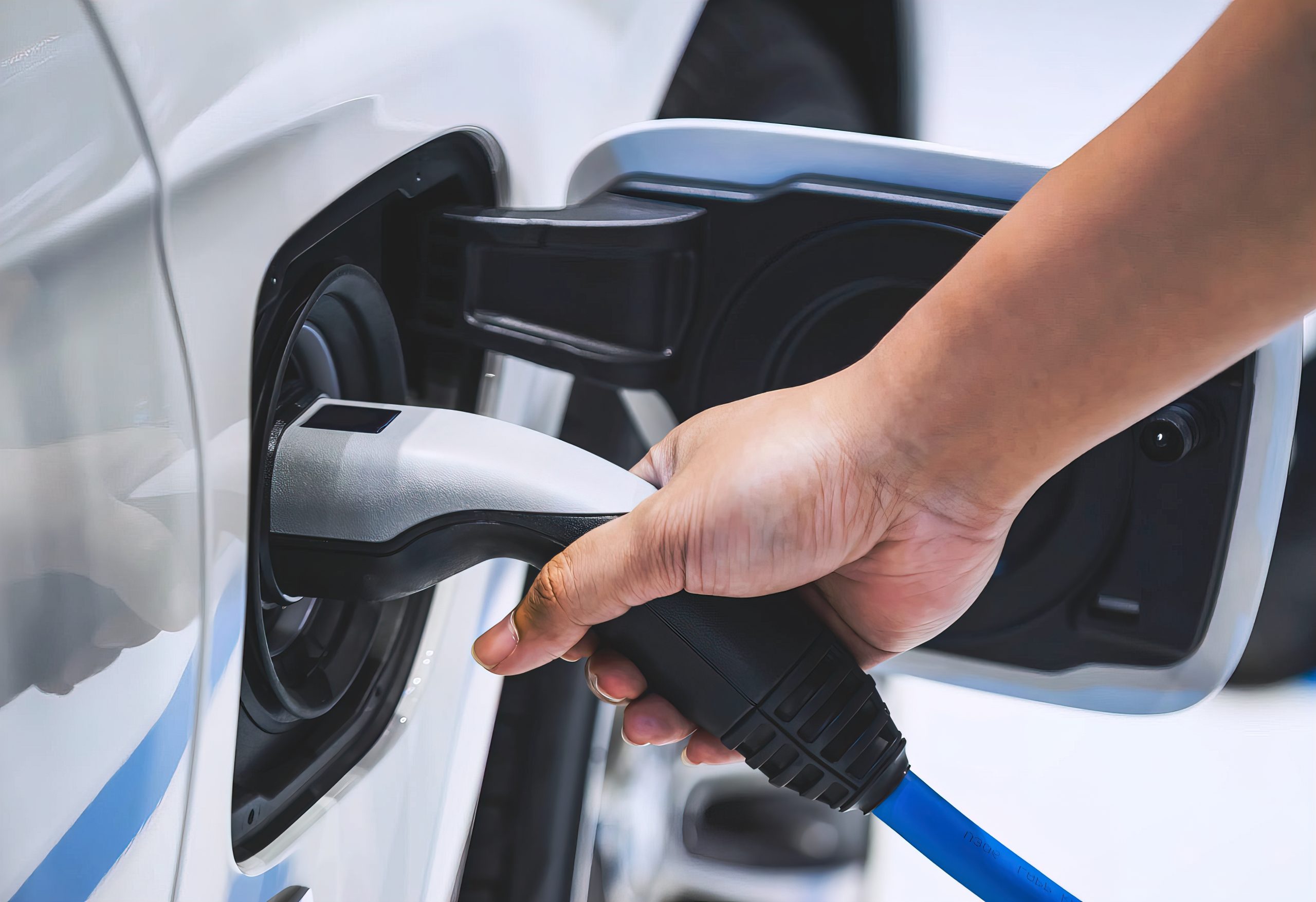 A charging plug for an electric vehicle being inserted