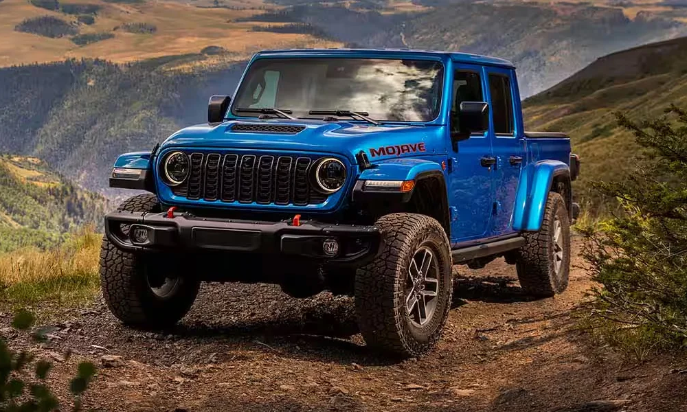 A Jeep Gladiator climbing up a mountainside