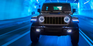 A photo of a silver 2025 Jeep Wrangler 4xe driving through a tunnel near Redford, MI